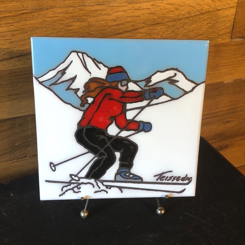 Vintage Cleo Teissedre ceramic tile or trivet featuring hand-painted skier